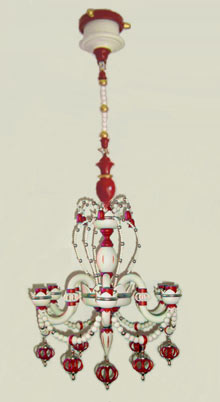 Leuchterspinne wollweiss-bordeaux-gold